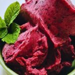 bowl of blueberry sorbet with sprig of mint