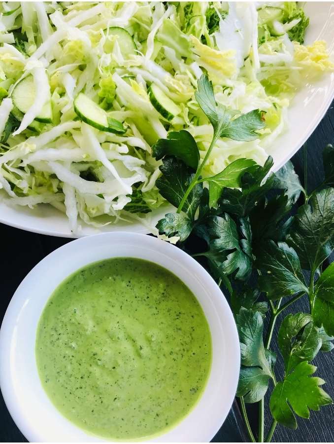 Green Goddess Salad dressing with green goddess salad and a photo of parsley