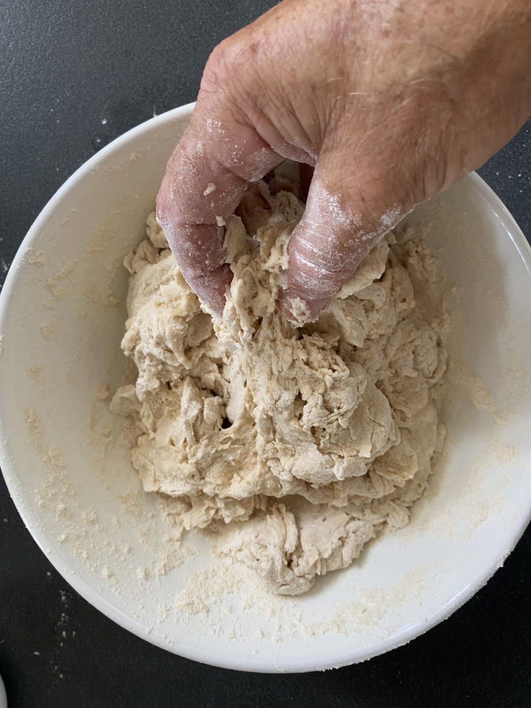 hand mixing the sourdough