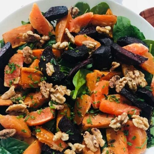 roasted beetroot and sweet potato salad with orange vinaigrette dressing with salad servers