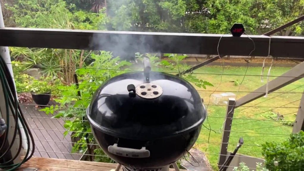 lid on the weber kettle grill with smoke