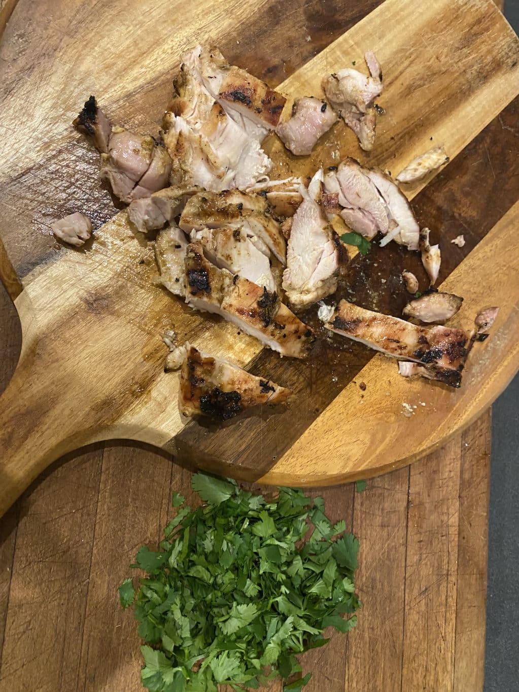 thai coconut chiken thighs cut up on board