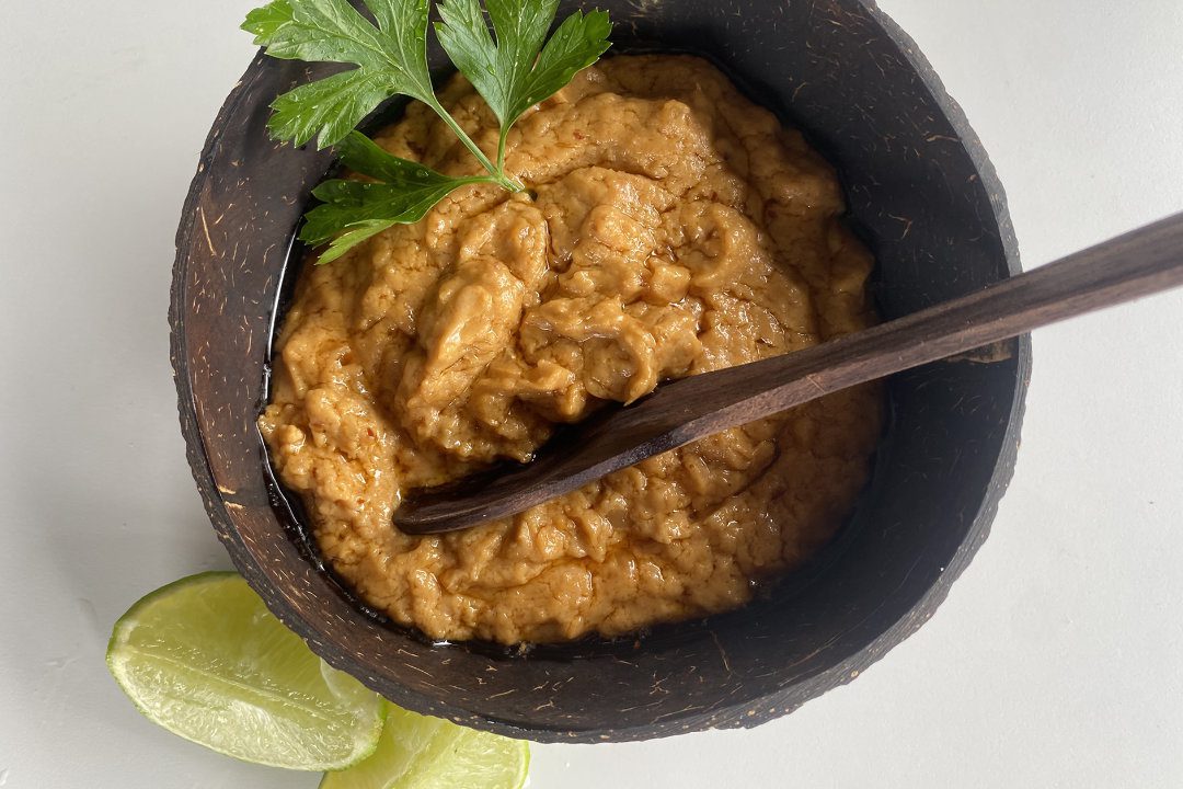 authentic thai peanut sauce in a coconut bowl