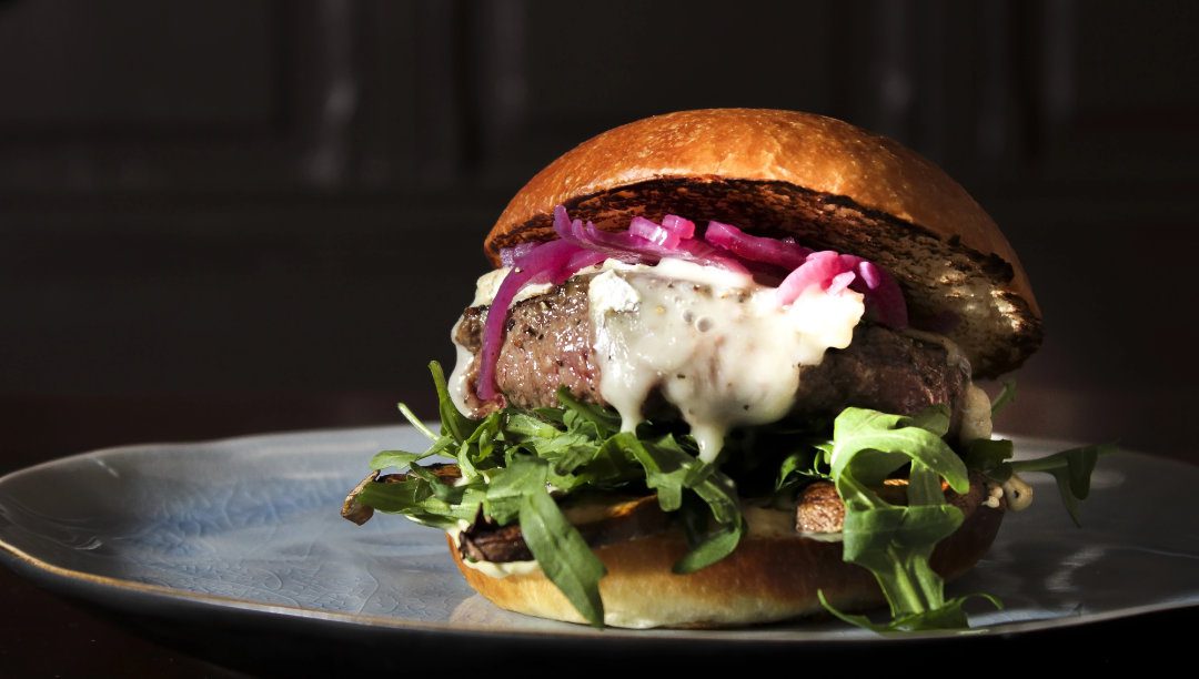 pickled red onions on a burger