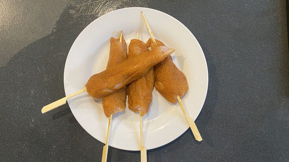 satay chicken sticks coated in spice rub mixture