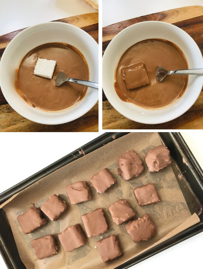 white bowl with melted chocolate with fork dipping and coating and placing on a tray