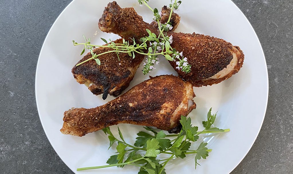 make a dry rub and coat chicken drumsticks