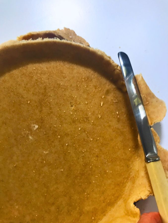 triming the dough for the pie flan