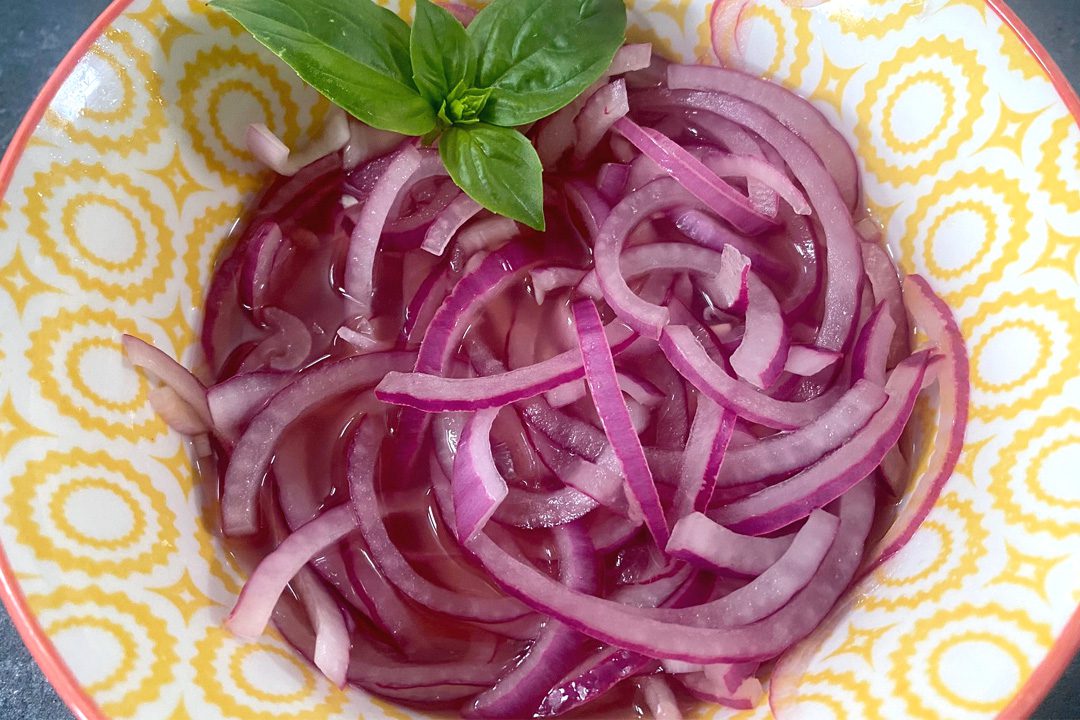 pickled red onions in a bowl