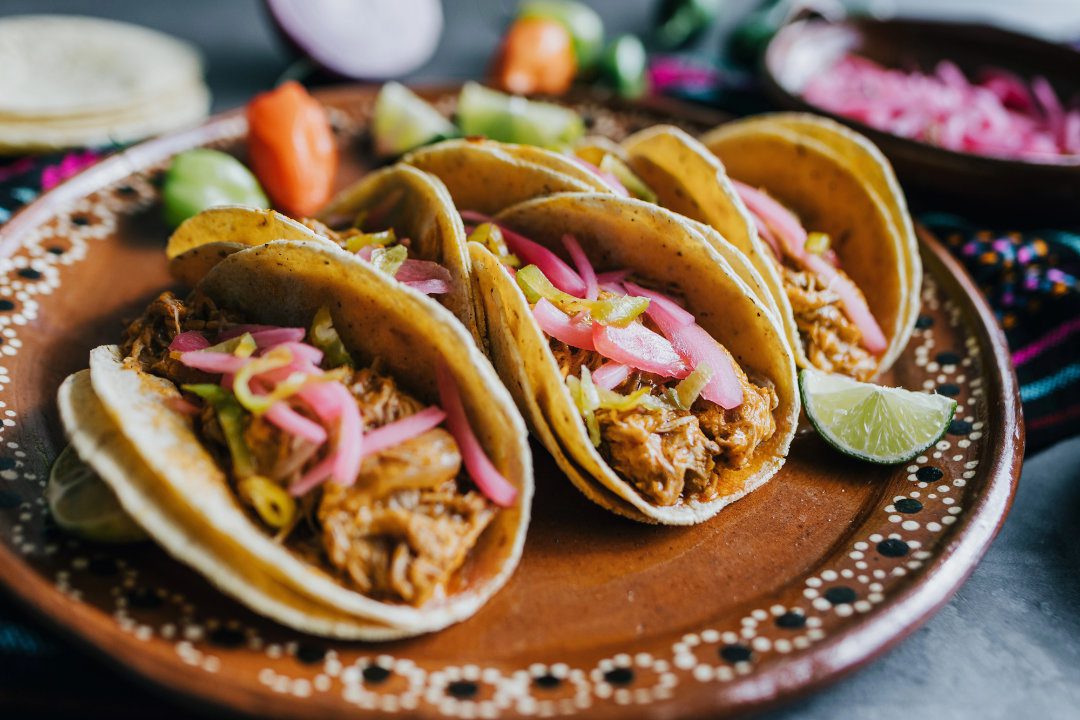 pickled red onions with pulled pork tacos