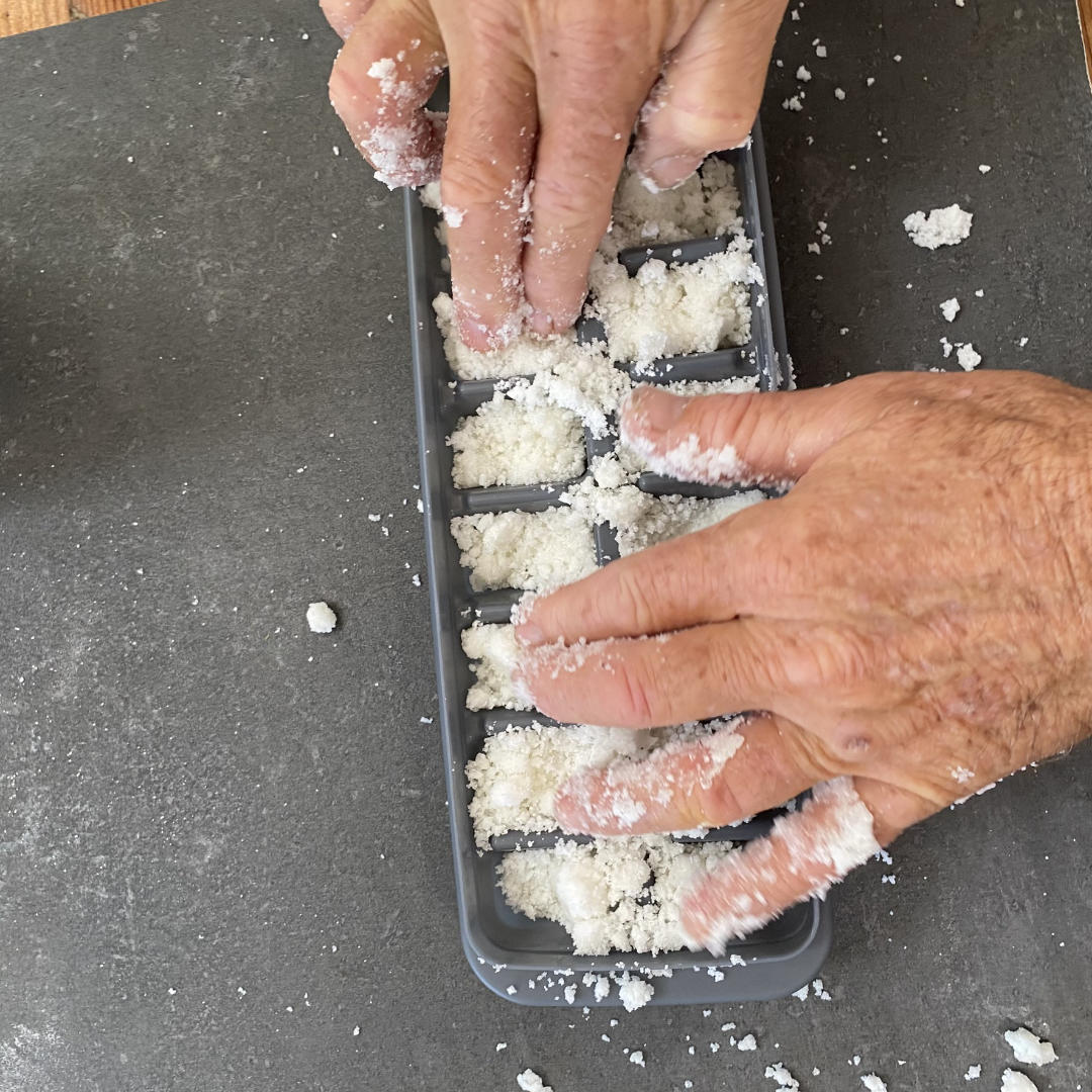 pressing the mixture into the moulds