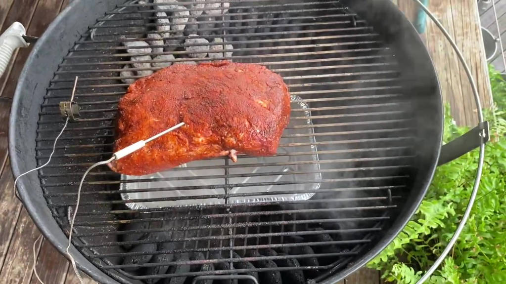 placing the pork scotch on the grill rack