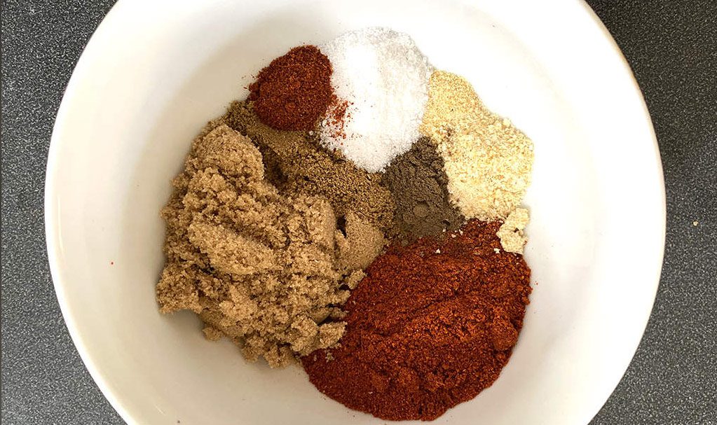 sweet and spicy pork rub consists of a few spices in the bowl